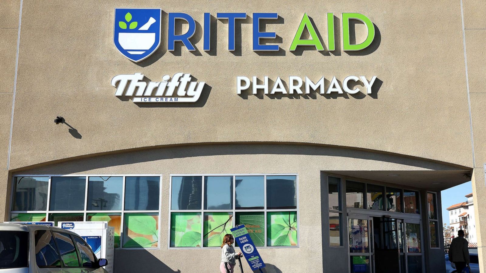 PHOTO: People walk outside a Rite Aid store on Dec. 21, 2022 in Los Angeles.