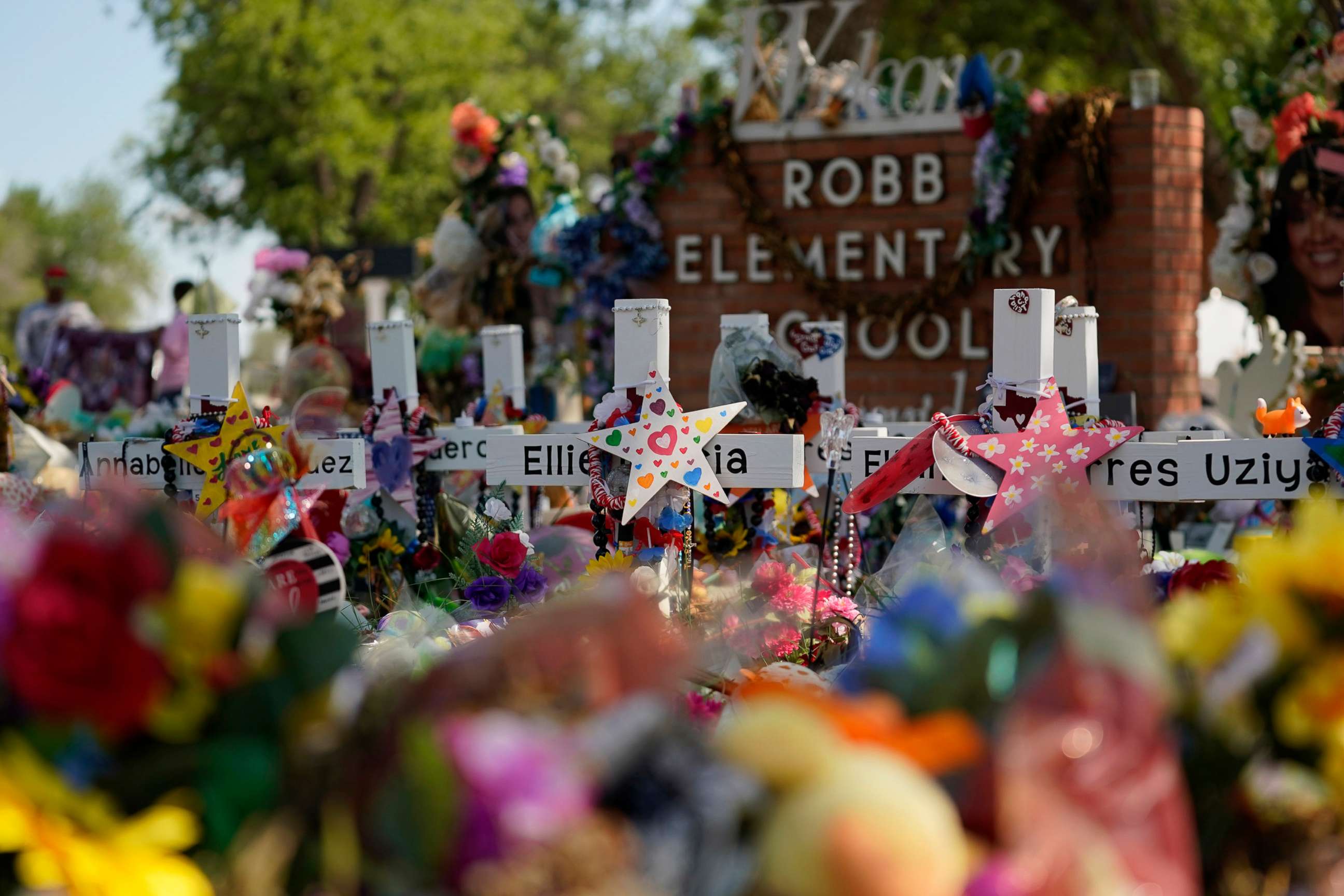 PHOTO: A makeshift memorial honoring those recently killed is formed around Robb Elementary School, July 10, 2022, in Uvalde, Texas. 