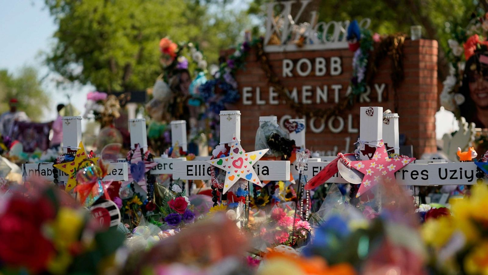 PHOTO: A makeshift memorial honoring those recently killed is formed around Robb Elementary School, July 10, 2022, in Uvalde, Texas.