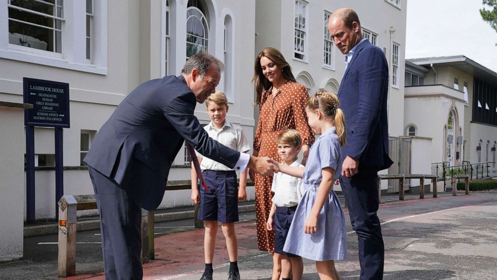 PHOTO: From second left, Britain's Prince George, Kate Duchess of Cambridge, Prince Louis, Prince William and Princess Charlotte are greeted by Headmaster Jonathan Perry, left, at Lambrook School, near Ascot, England, Sept. 7, 2022. 