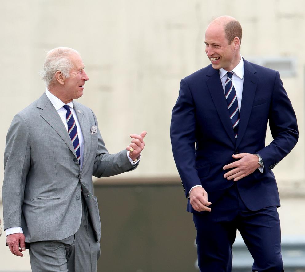 PHOTO: King Charles III and Prince William, Prince of Wales share a joke during the official handover in which King Charles III passes the role of Colonel-in-Chief of the Army air corps to Prince William in Stockbridge, Hampshire, May 13, 2024.