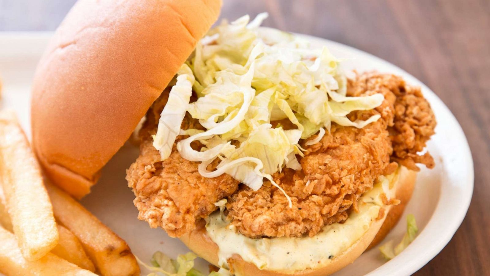 PHOTO: A fried chicken sandwich with shredded iceberg lettuce.