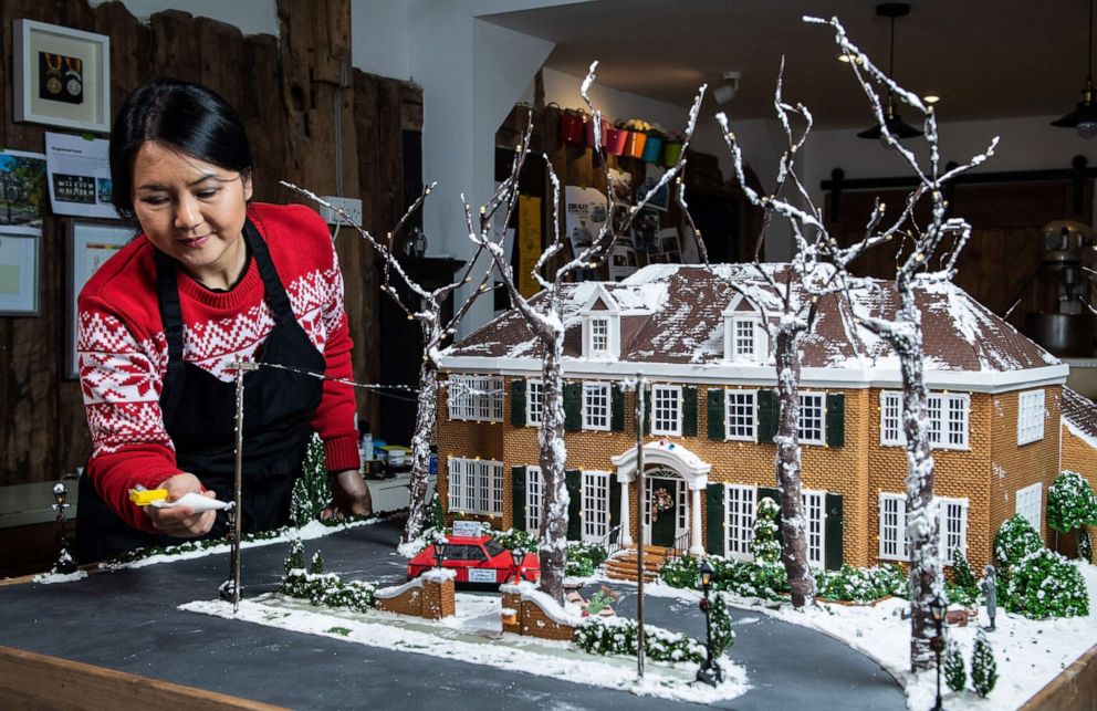 PHOTO: Cake designer Michelle Wibowo works on the McCallister gingerbread house to celebrate the 30th anniversary of "Home Alone."
