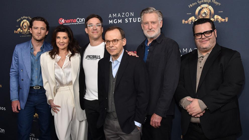 PHOTO: Actors Lewis Pullman, Daphne Zuniga, director Josh Greenbaum, actors Rick Moranis, Bill Pullman and Josh Gad promote the upcoming film "Spaceballs: The New One" during the Amazon MGM Studios photo call during CinemaCon on April 15, 2026.