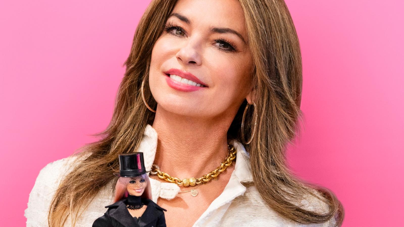 PHOTO: Shania Twain holding her one-of-a-kind role model Barbie doll.