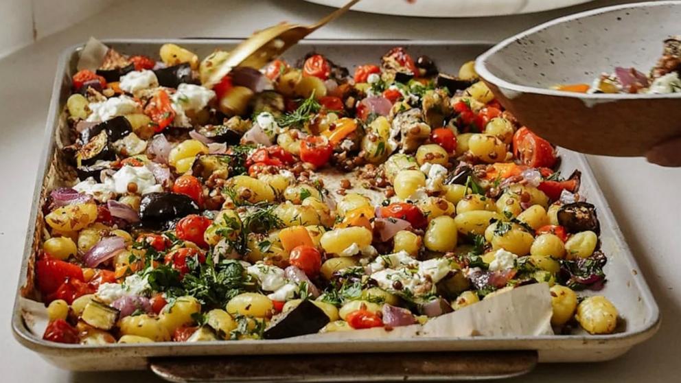 PHOTO: A pan of sheet tray gnocchi with lentils and vegetables.