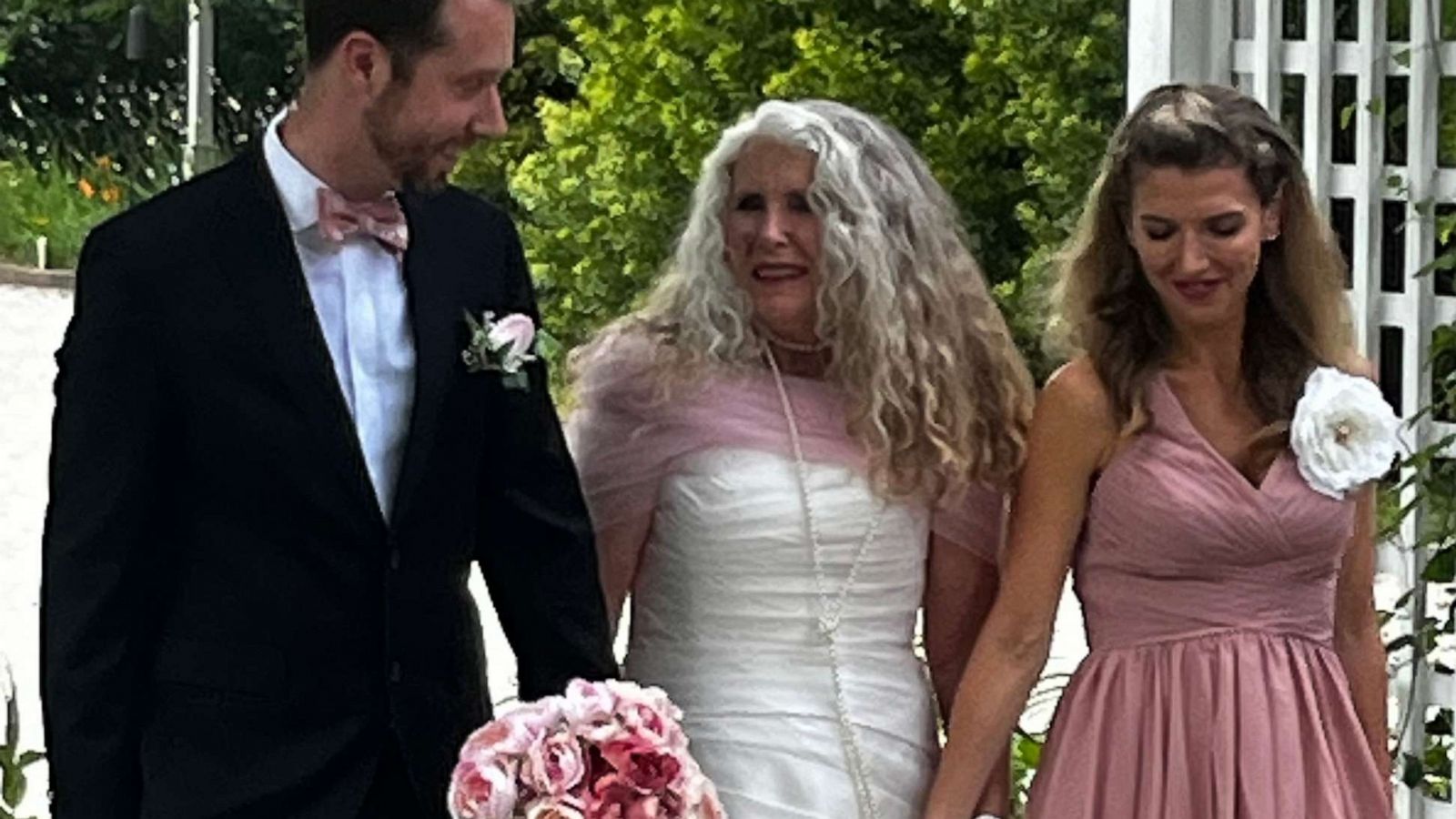 PHOTO: Sheri James (center) had two of her cancer doctors, Dr. Van Morris and Dr. Emma Holliday, walk her down the aisle at her June wedding.