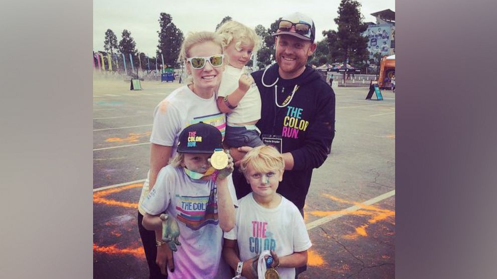 PHOTO: Travis Snyder, founder of The Color Run, poses with his wife and children.