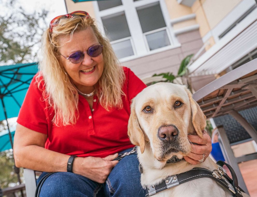 PHOTO: Lisa Kemp with her guide dog Charlie.