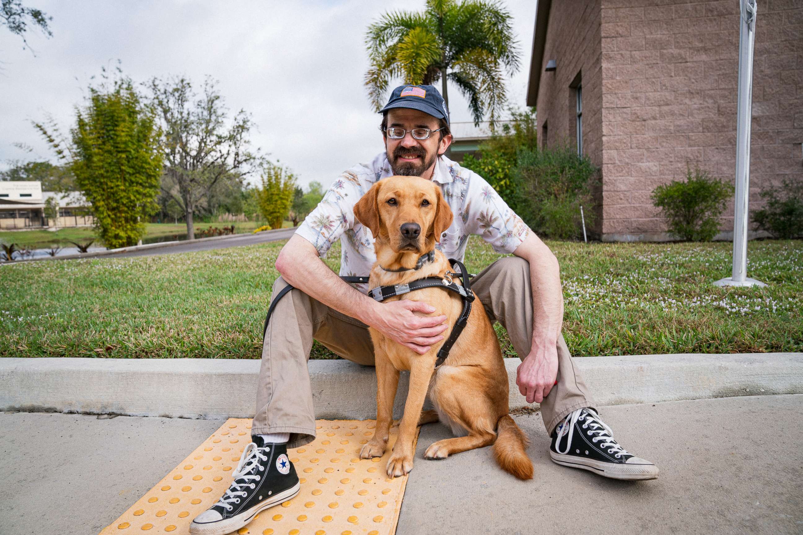 PHOTO: Mike Moaba with his guide dog Clara.