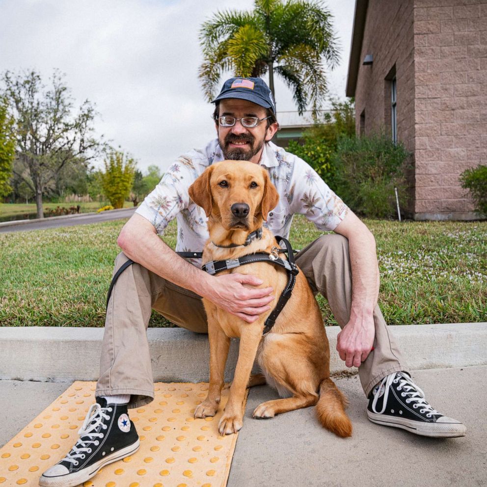 PHOTO: Mike Moaba with his guide dog Clara.