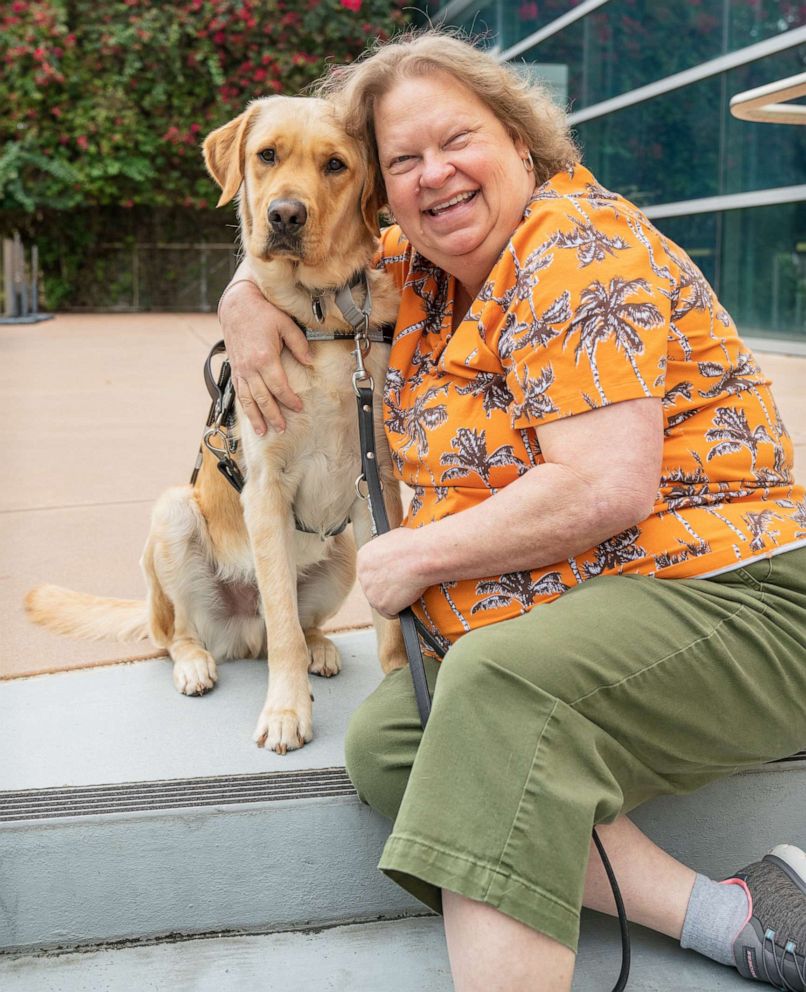 PHOTO: Lynn Puckett with her guide dog AJ.