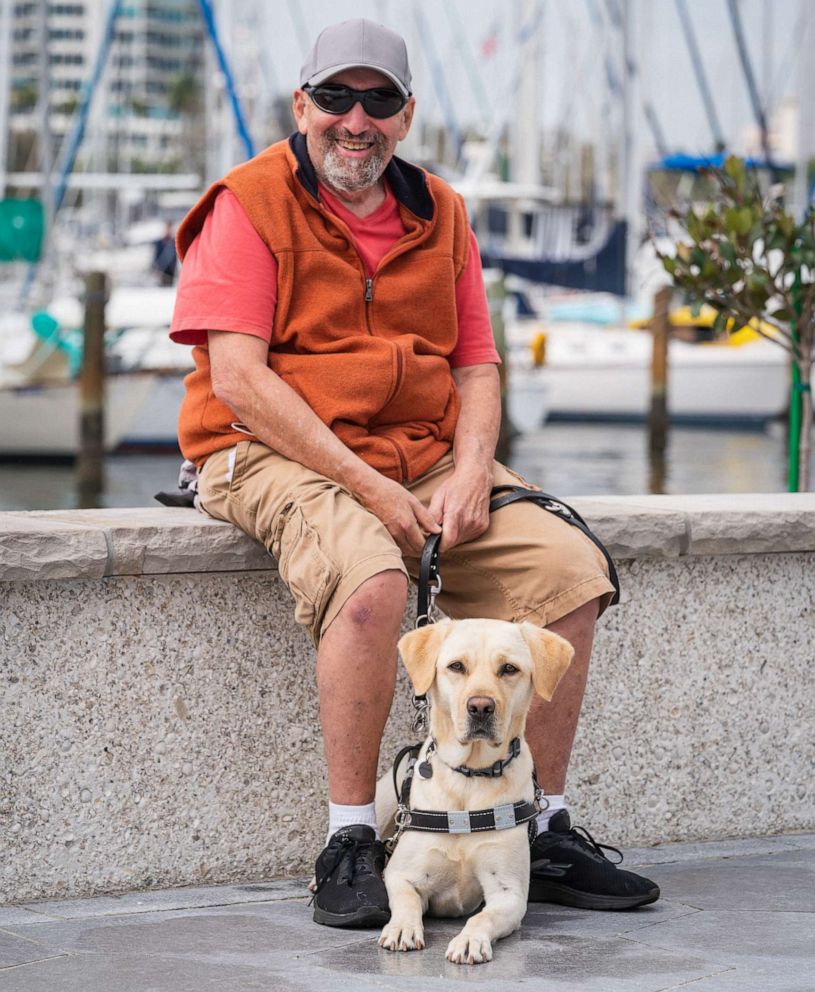 PHOTO: Sanford Steinberg with his guide dog Alfie.