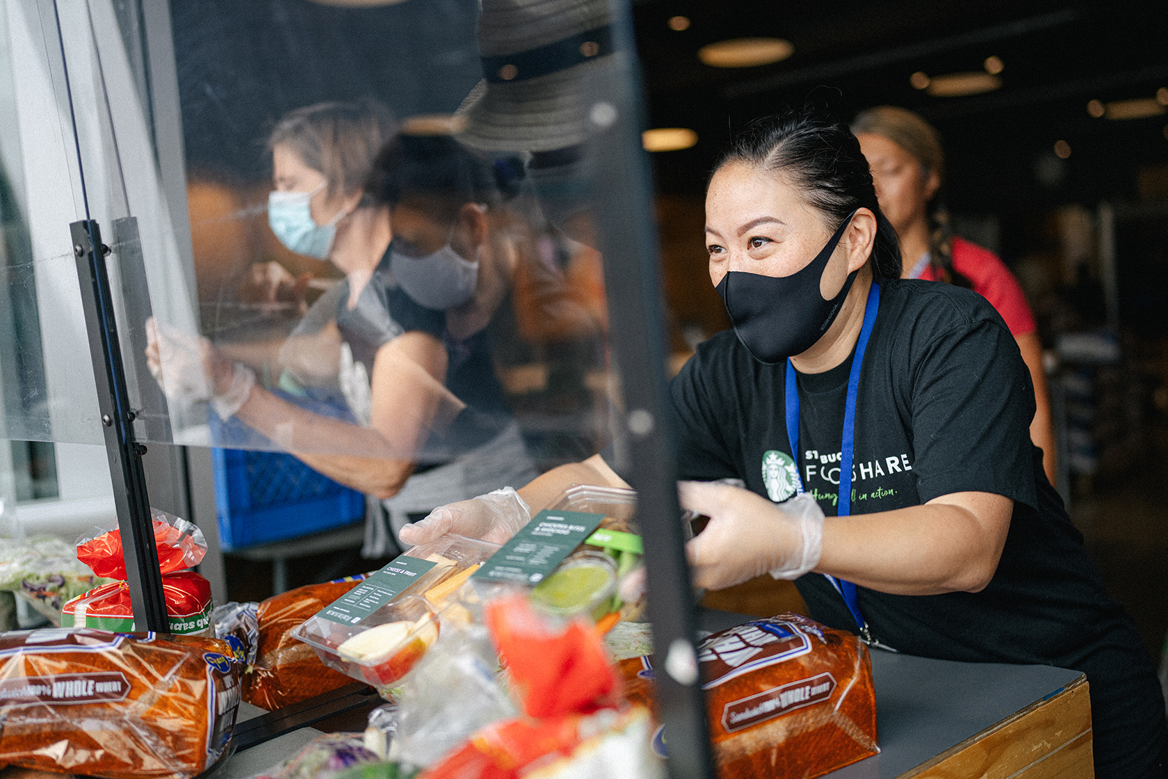 PHOTO: A Starbucks employee works to gather food to be donated. 