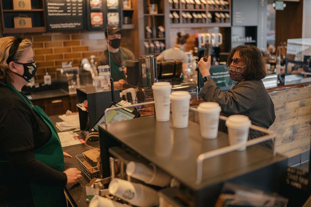 PHOTO: A woman gets virtual assistance using Aira inside Starbucks.