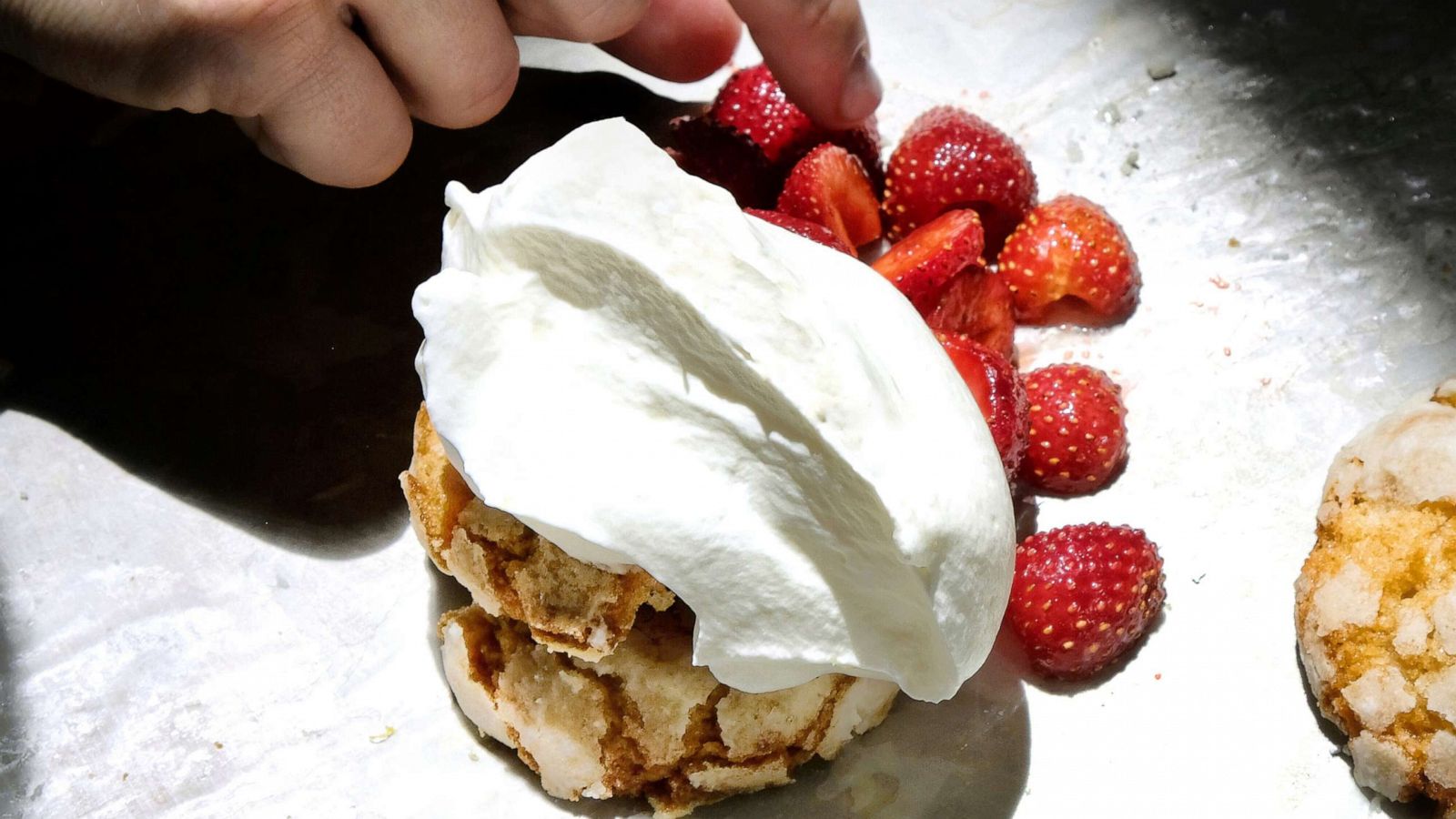 PHOTO: Strawberry shortcakes from Milk Bar with a large dollop of whipped cream and macerated strawberries.