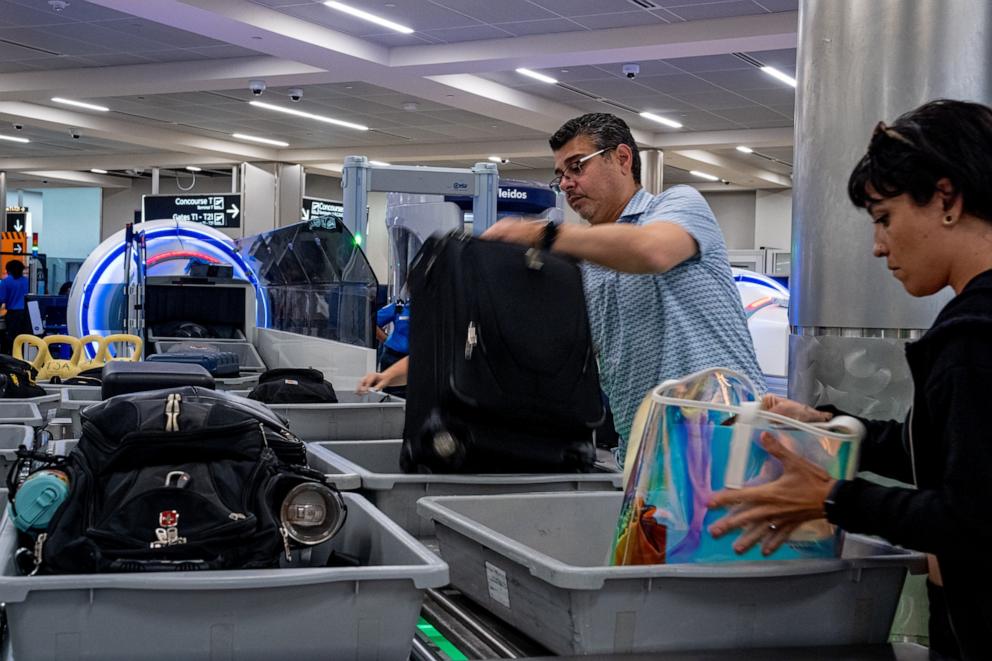 PHOTO: Travelers go through a security screening at Hartsfield-Jackson Atlanta International Airport in Atlanta, GA, June 28, 2024.