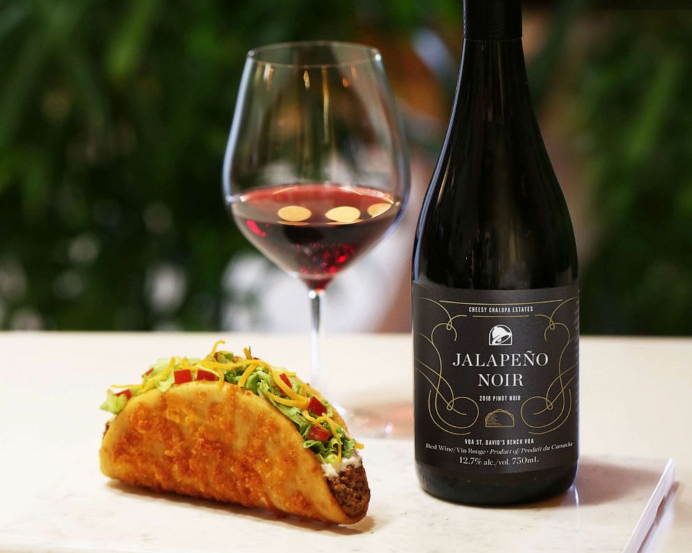 PHOTO: An aged-cheddar chalupa and Jalapeno Noir wine from Taco Bell in Canada.