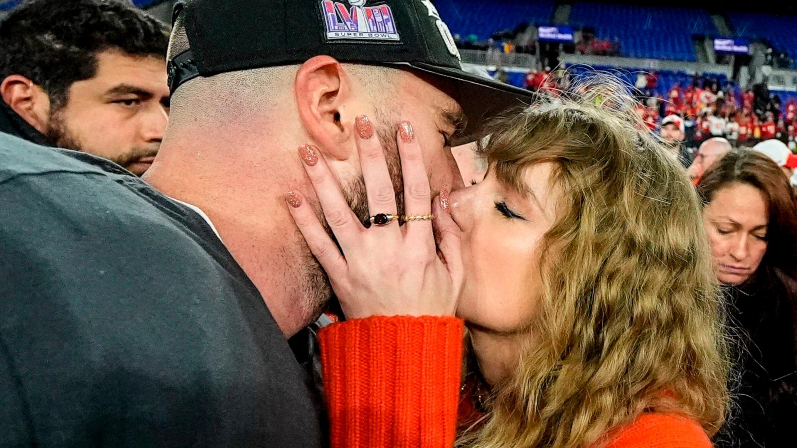 PHOTO: Taylor Swift kisses Kansas City Chiefs tight end Travis Kelce after an AFC Championship NFL football game against the Baltimore Ravens in Baltimore, MD, Jan. 28, 2024.