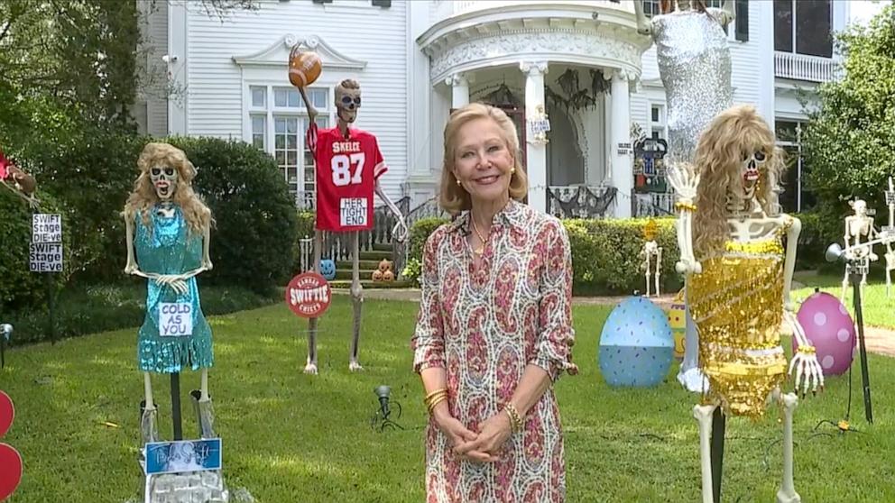 PHOTO: Louellen Berger in front of her New Orleans home, which is decked out for Halloween with Taylor Swift-themed giant skeletons.