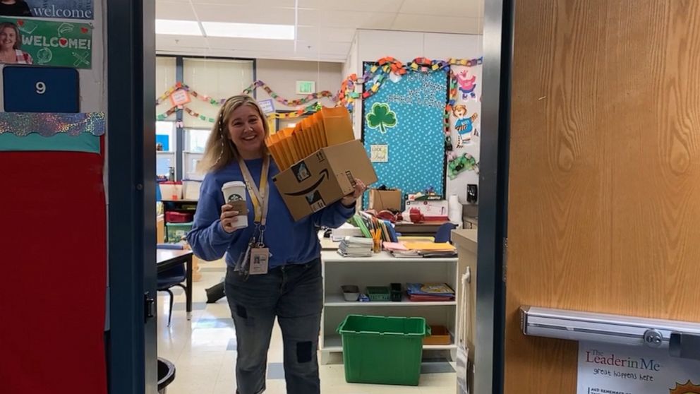 PHOTO: Heidi Robinson assembles reading packets for her students and drops off them to each of her students' homes. 