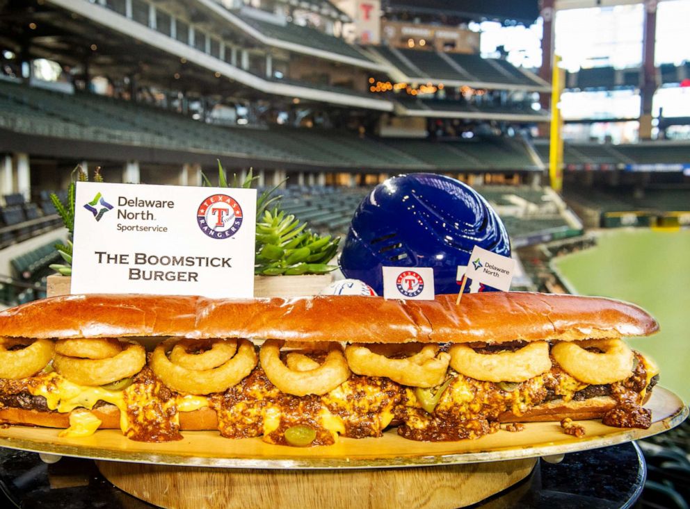 PHOTO: The new Boomstick Burger, a 2-foot-long Nolan Ryan Beef patty topped with Texas Chili Company Chili, Rico's Nacho Cheese and Jalapenos, and Crisp Onion Rings and served on a fresh-baked brioche bun.