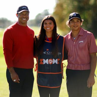 PHOTO: Tiger Woods, son Charlie Woods, and daughter Sam Woods stand on the first tee during the second round of the PNC Championship at Ritz-Carlton Golf Club in Orlando, Fla., Dec. 22, 2024.