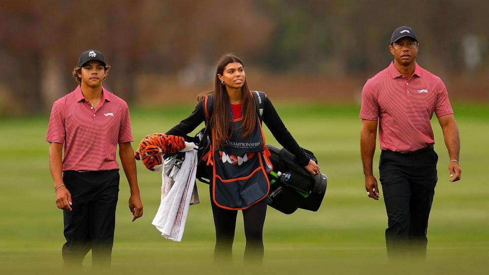 PHOTO: Tiger Woods with his son Charlie Woods and daughter Sam Woods on the 18th hole during the second round of the PNC Championship at Ritz-Carlton Golf Club in Orlando, Fla., Dec. 22, 2024.