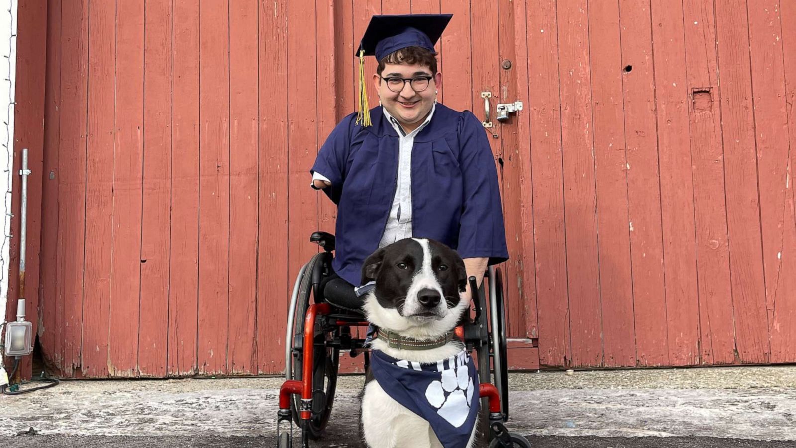 PHOTO: Tim Mason pictured at graduation with his dog.