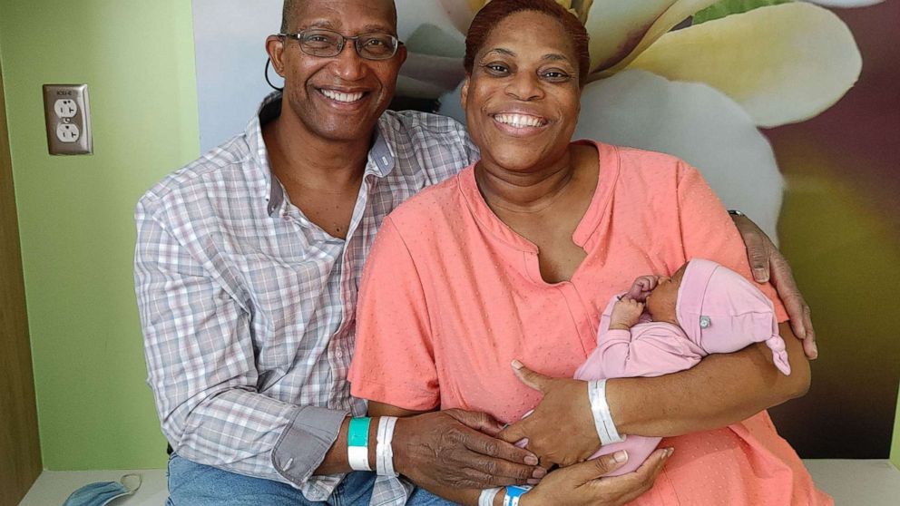 PHOTO: Tony and Susie Troxler pose with their newborn daughter, Lily.