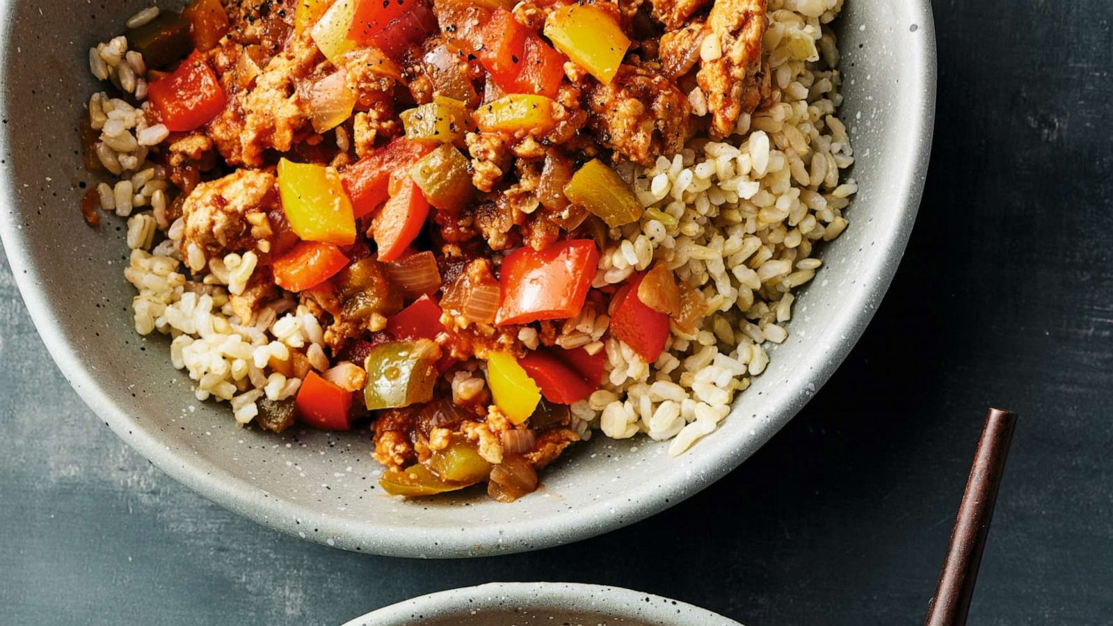 PHOTO: A bowl of rice with sauteed bell pepper and ground turkey.