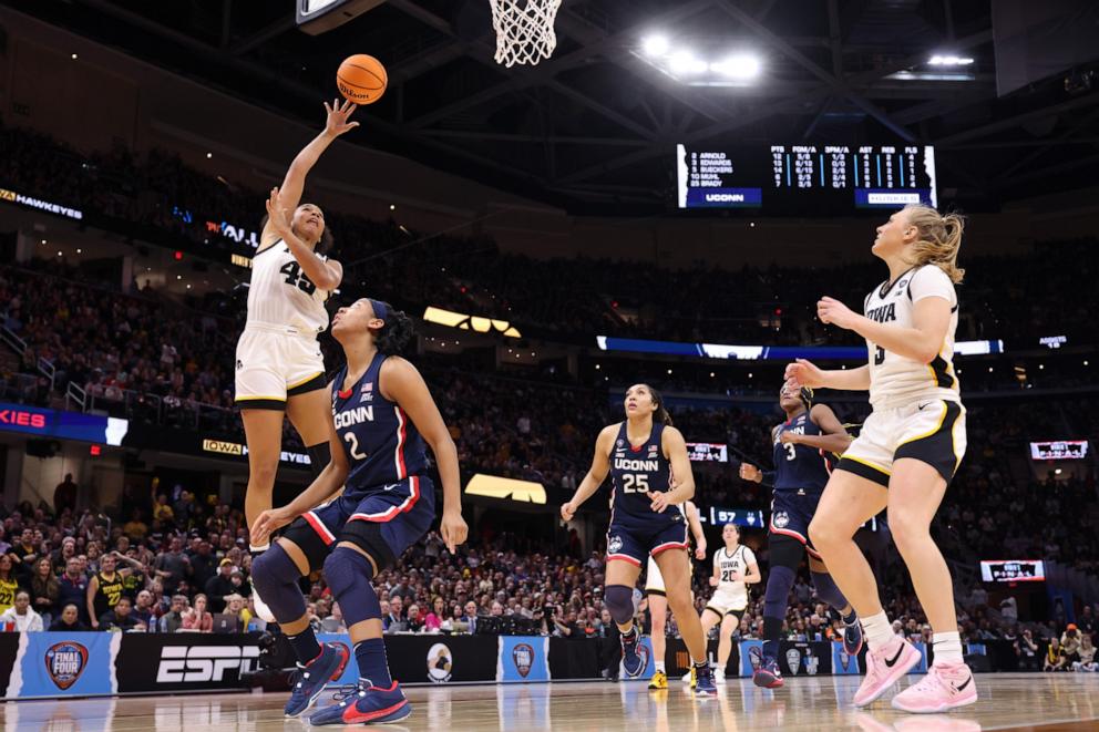 PHOTO: Hannah Stuelke #45 of the Iowa Hawkeyes shoots the ball over KK Arnold #2 of the UConn Huskies during the NCAA Women's Basketball Tournament Final Four semifinal game in Cleveland, OH, April 05, 2024.