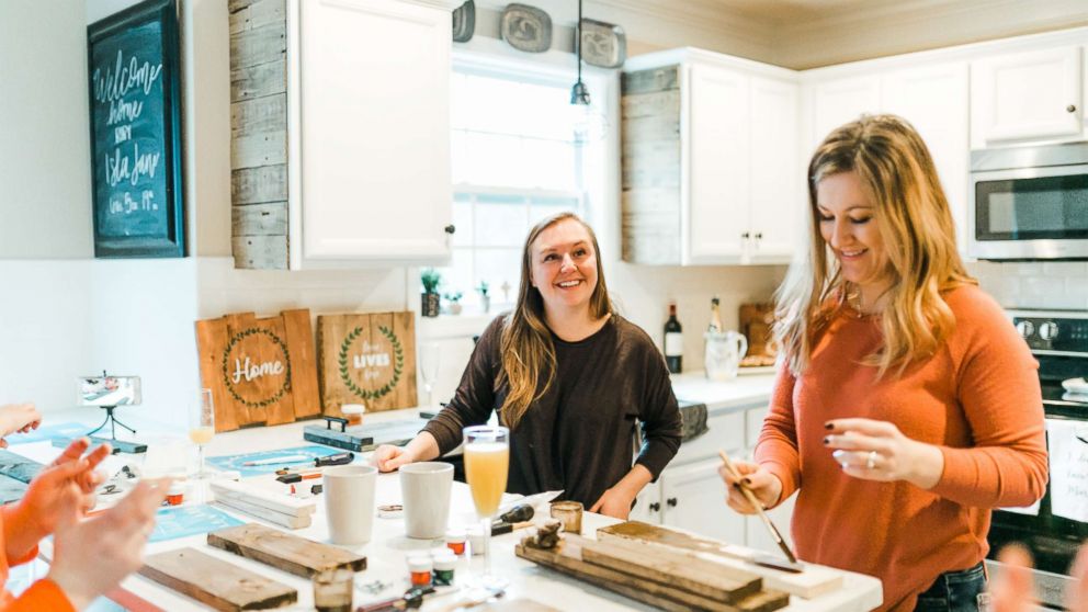 PHOTO: Ashley McAlpin, left, joins a friend in working on a McAlpin Creative DIY kit.