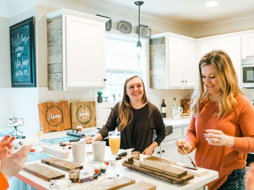 PHOTO: Ashley McAlpin, left, joins a friend in working on a McAlpin Creative DIY kit.