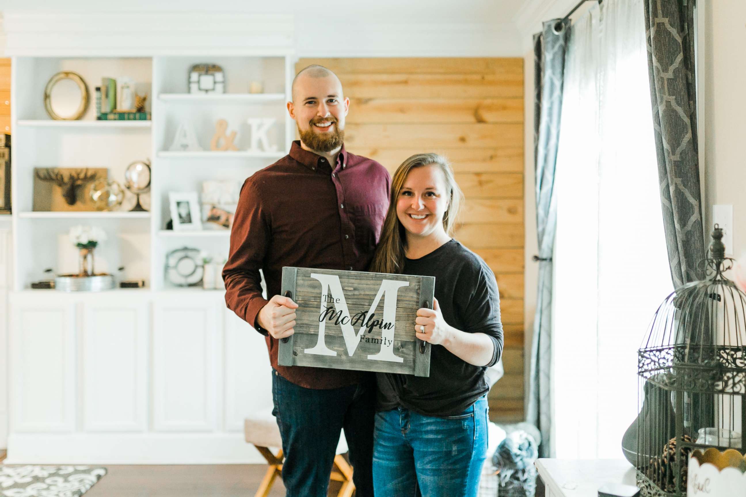 PHOTO: Kevin and Ashley McAlpin pose with a product from their company, McAlpin Creative.