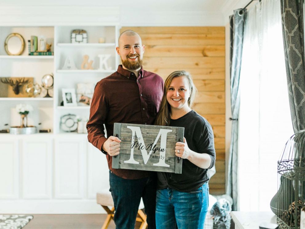 PHOTO: Kevin and Ashley McAlpin pose with a product from their company, McAlpin Creative.