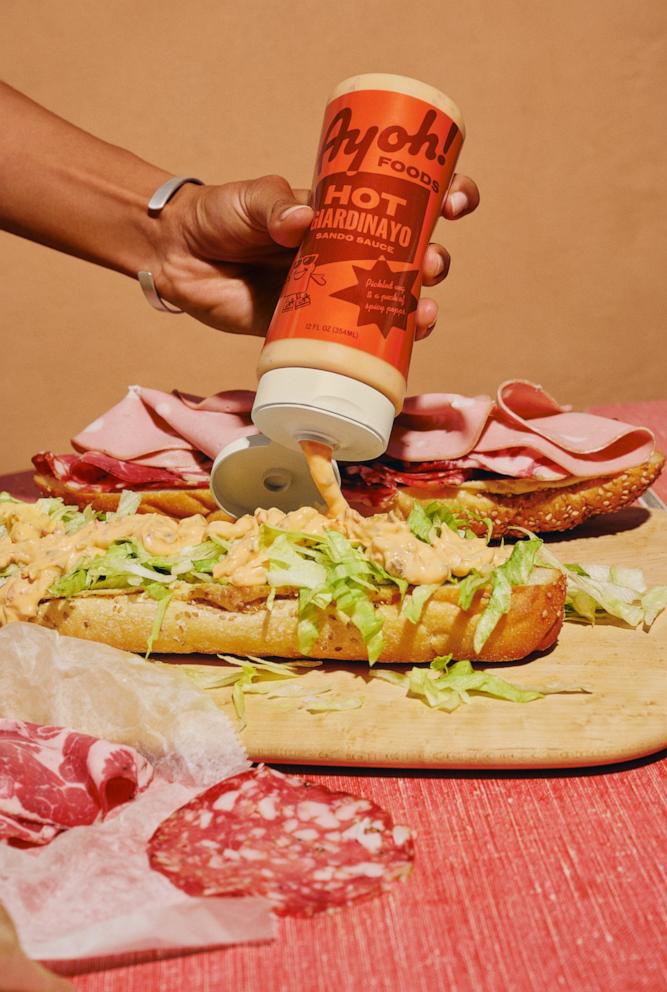 PHOTO: A bottle of Hot Giardinayo being used to make a sandwich.