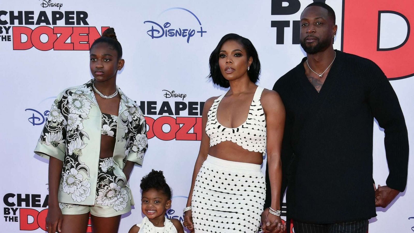 PHOTO: Gabrielle Union (2R) and Dwayne Wade pose with daughters Zaya Wade (L) and Kaavia James Union Wade (2L) as they arrive for the "Cheaper by the Dozen" Disney premiere at the El Capitan theatre in Hollywood, Calif., March 16, 2022.