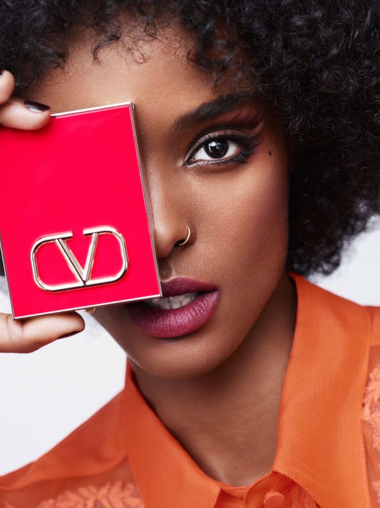 PHOTO: Model holds a palette from the Valentino Beauty collection.
