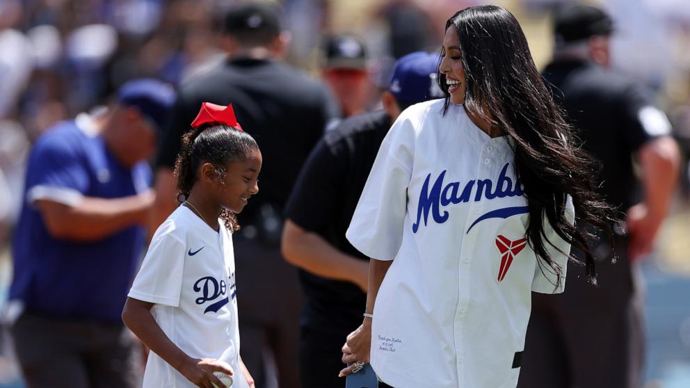 PHOTO: Bianka Bryant and Vanessa Bryant walk off the field after the first pitch prior to the game between the Los Angeles Dodgers and the Tampa Bay Rays at Dodger Stadium on Aug. 25, 2024 in Los Angeles.