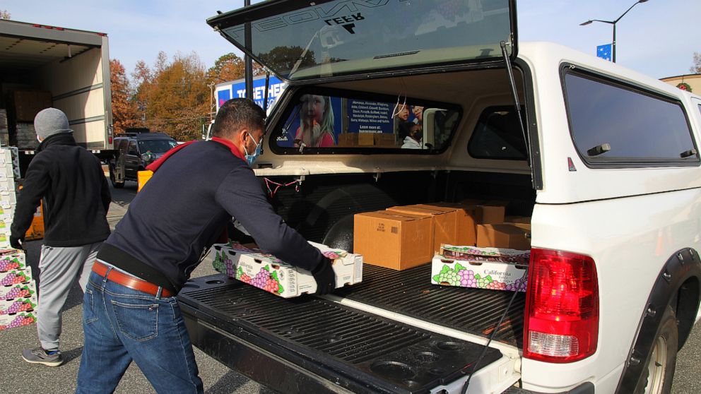 PHOTO: A volunteer helps unload food for Second Harvest Food Bank of Northwest North Carolina.