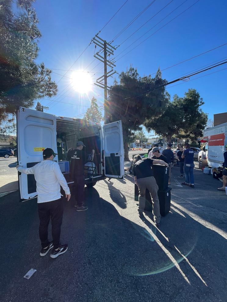 PHOTO: Volunteers for World Central Kitchen load a van with hot meals to distribute in Los Angeles to fire evacuees and first responders. 