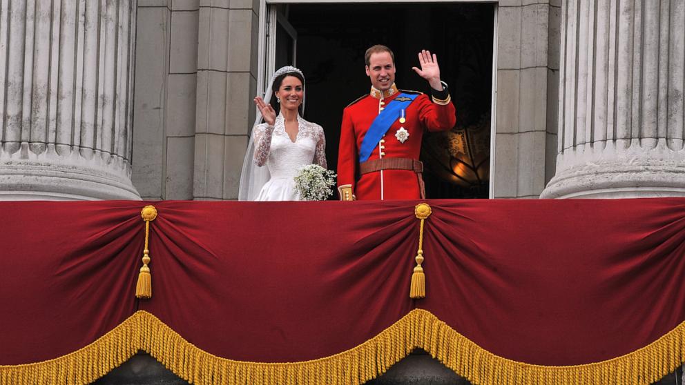 PHOTO: Their Royal Highnesses Prince William, Duke of Cambridge and Catherine, Duchess of Cambridge wave on the balcony at Buckingham Palace during the Royal Wedding in London, England, April 29, 2011.