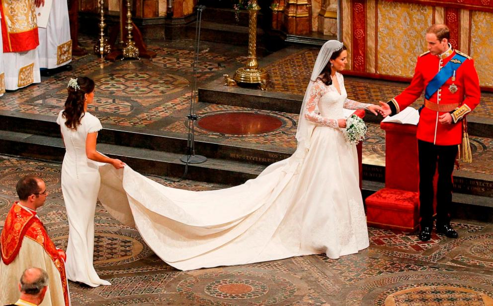 PHOTO: Prince William, Duke of Cambridge, his new bride Catherine, Duchess of Cambridge and Pippa Middleton (L) take part in the service in London, England, April 29, 2011.