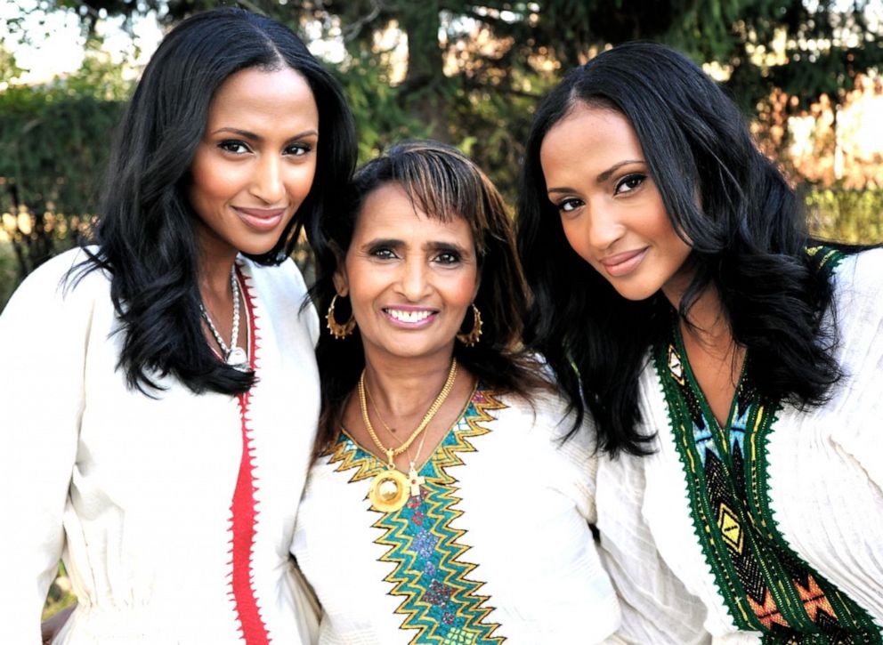 PHOTO: Feven Yohannes (left) and Helena Yohannes (right) with their mother, Nigisti, who inspired their lipstick color "Red Sea."