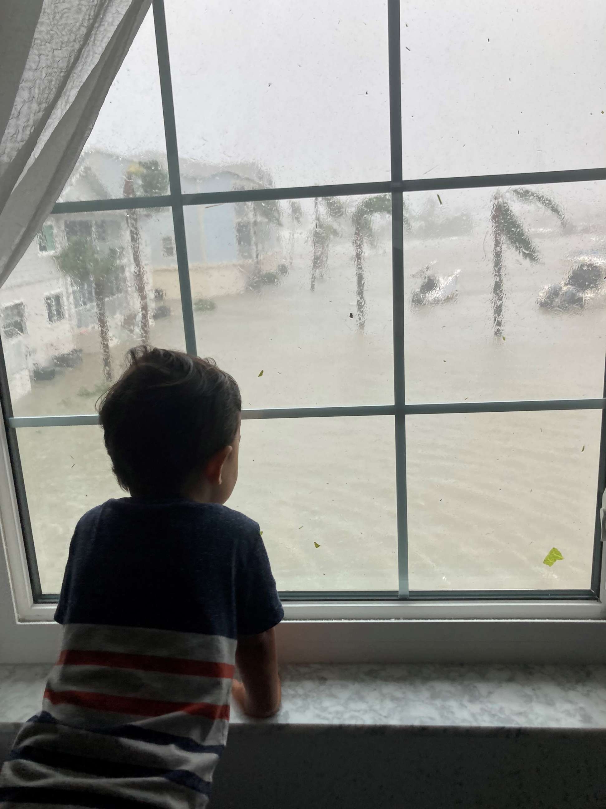 PHOTO: Zhenia Lopez-Figueroa's 2-year-old son watches Hurricane Ian from the family's Fort Myers Beach, Florida, apartment.