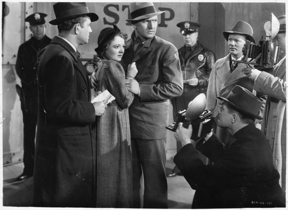 PHOTO: Janet Gaynor, as Vicki Lester, and Fredric March, as Norman Maine Stand, are surrounded by photographers and reporters in a scene from the 1937 film, "A Star Is Born."