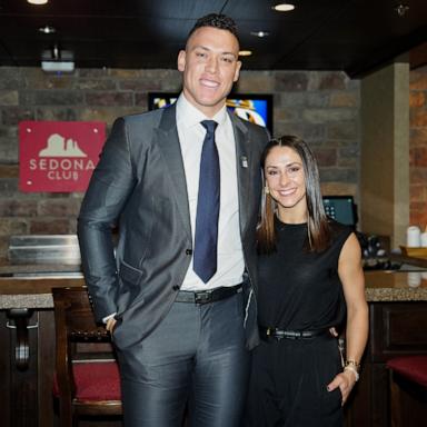 PHOTO: Aaron Judge of the New York Yankees and his wife, Samantha Bracksieck, pose for a photo during a Make-A-Wish foundation meet and greet at the 2023 World Series between the Texas Rangers and the Arizona Diamondbacks in Phoenix, Ariz., Oct. 30, 2023.