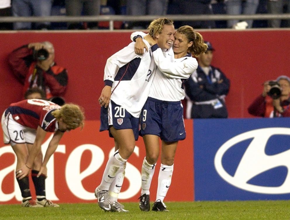 PHOTO: Mia Hamm celebrates with a hug from Abby Wambach, October 1, 2003, during the quarterfinals of the FIFA Women's World Cup USA. 