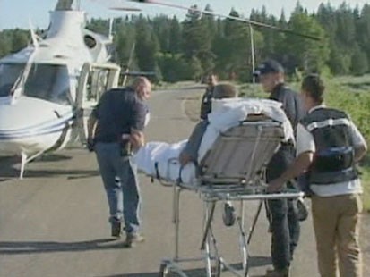 VIDEO: A gurney being wheeled to a MEDVAC helicopter.